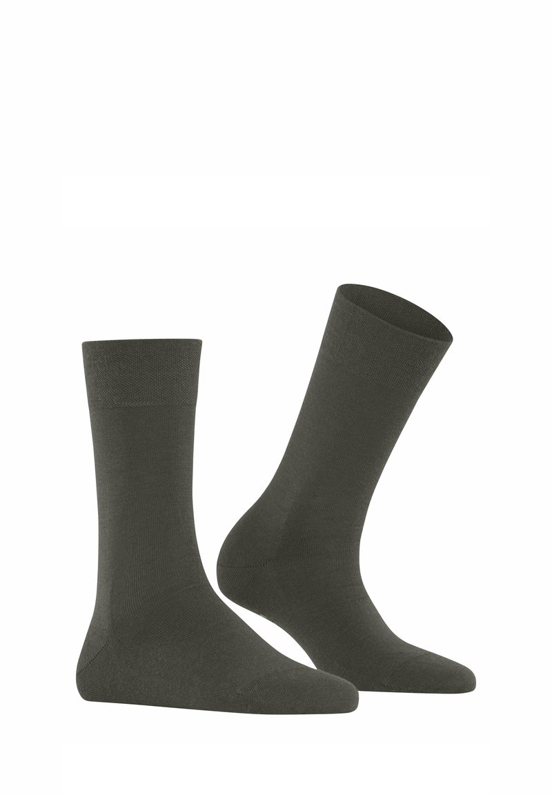 Dunkelgrüne Baumwollsocken mit glatter Textur, Knöchelhöhe und verstärktem Zehen- und Fersenbereich, die ein einfaches, nahtloses Design aufweisen.