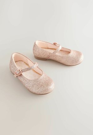 Różowe złote błyszczące buty Mary Jane z płaską podeszwą, okrągłym noskiem i paskiem z sercową klamrą. Miękka podszewka.