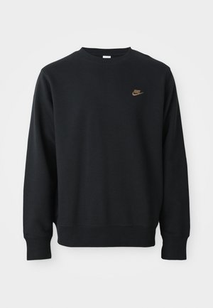 Černá mikina vyrobená z měkké látky, s kulatým výstřihem, dlouhými rukávy a malým zlatým logem Nike na hrudi.