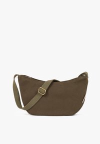 Brown canvas crossbody bag with adjustable woven strap and zipper closure, displayed against a white background.