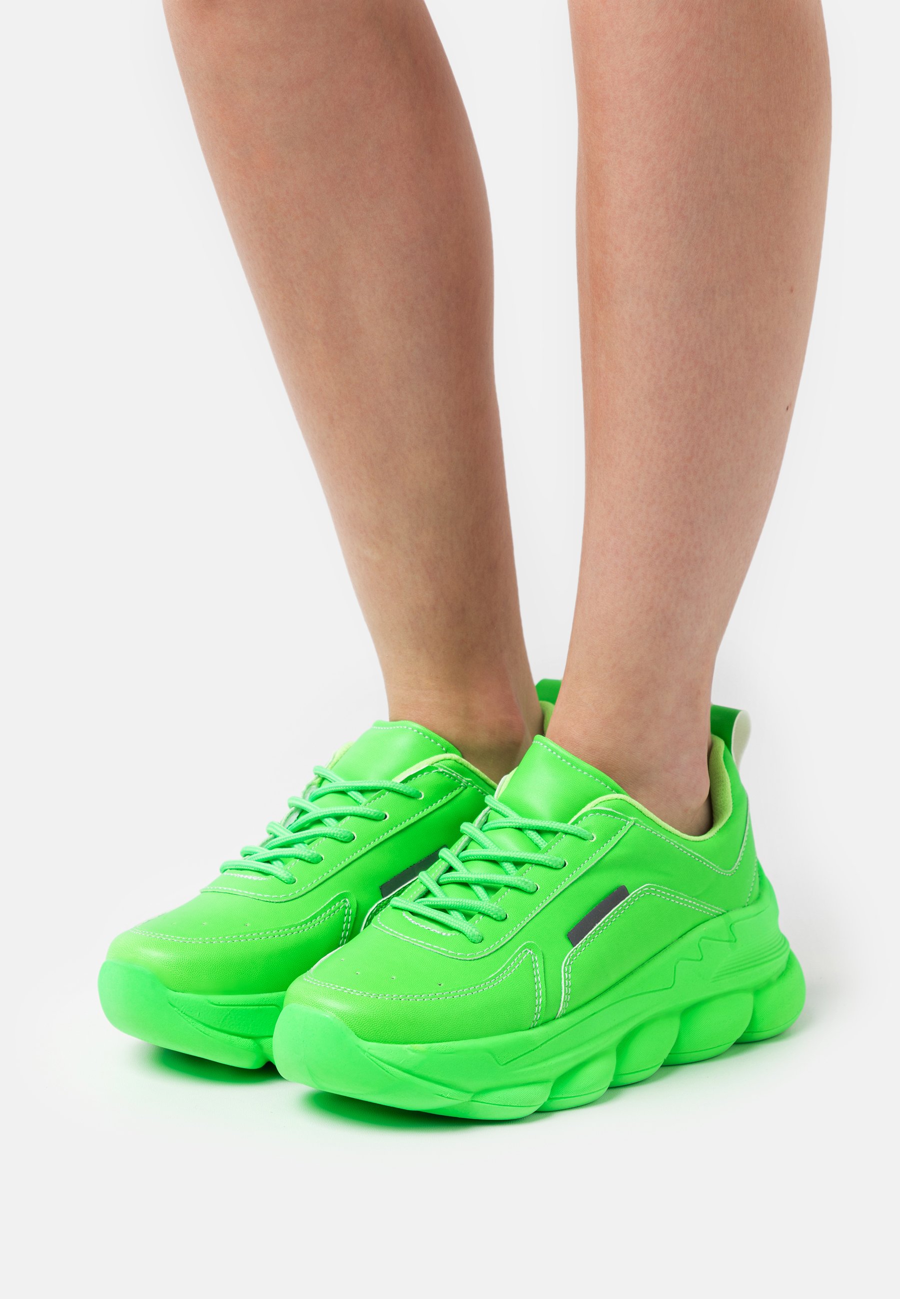 luminous green trainers