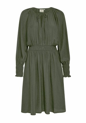 Olivno zelena obleka iz lahkega materiala, ki ima dolge rokave z nabranimi manšetami, nastavljiv izrez s vrvico in elastičen pas.