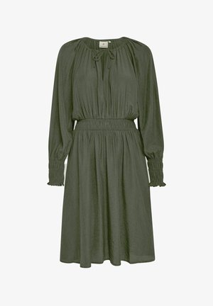 Olivno zelena obleka iz lahkega materiala, ki ima dolge rokave z nabranimi manšetami, nastavljiv izrez s vrvico in elastičen pas.