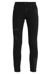 Svarta skinny jeans i denim med rivna detaljer fram och klassisk fem-fickorsdesign. Sitter tajt längs hela benet.