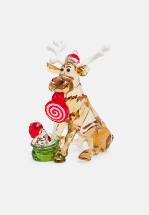 Crystal reindeer figurine with clear and amber hues, featuring white antlers and a red and white lollipop in a green container.