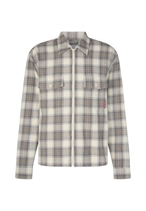 Ruitjes flanellen shirt in crèmekleurige, bruine en grijze tinten. Heeft een rits aan de voorkant, twee borstzakken en een zachte textuur met een gestructureerde kraag.