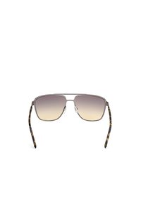 Occhiali da sole stile aviator con lenti a gradiente che passano dal grigio al trasparente. Montatura in metallo con bracci a motivo tartaruga. Naselli regolabili.