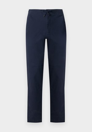 Pantalon droit bleu marine avec devant plat, poches latérales et taille élastique munie d'une patte noire ajustable.