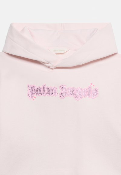 Sweat à capuche rose clair avec une capuche pliée et le texte « Palm Angels » en strass roses décoratifs sur la poitrine.