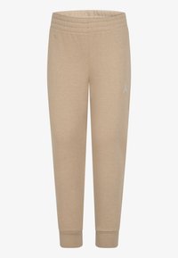 Pantalons de survêtement beiges avec taille et poignets élastiques, présentant un petit logo blanc sur la jambe gauche. Fabriqués en matériau doux mélangé coton.