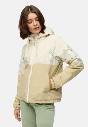 Veste beige légère avec un motif abstrait dans des pastels doux. Dotée d'une capuche, d'une fermeture éclair et de poignets élastiques. Poches avant incluses.