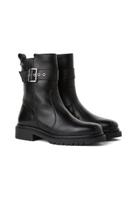 Svarta läderankelboots med rund tå, sidospänne, robusta sulor och en slitstark yta, med minimala sömnadsdetaljer.