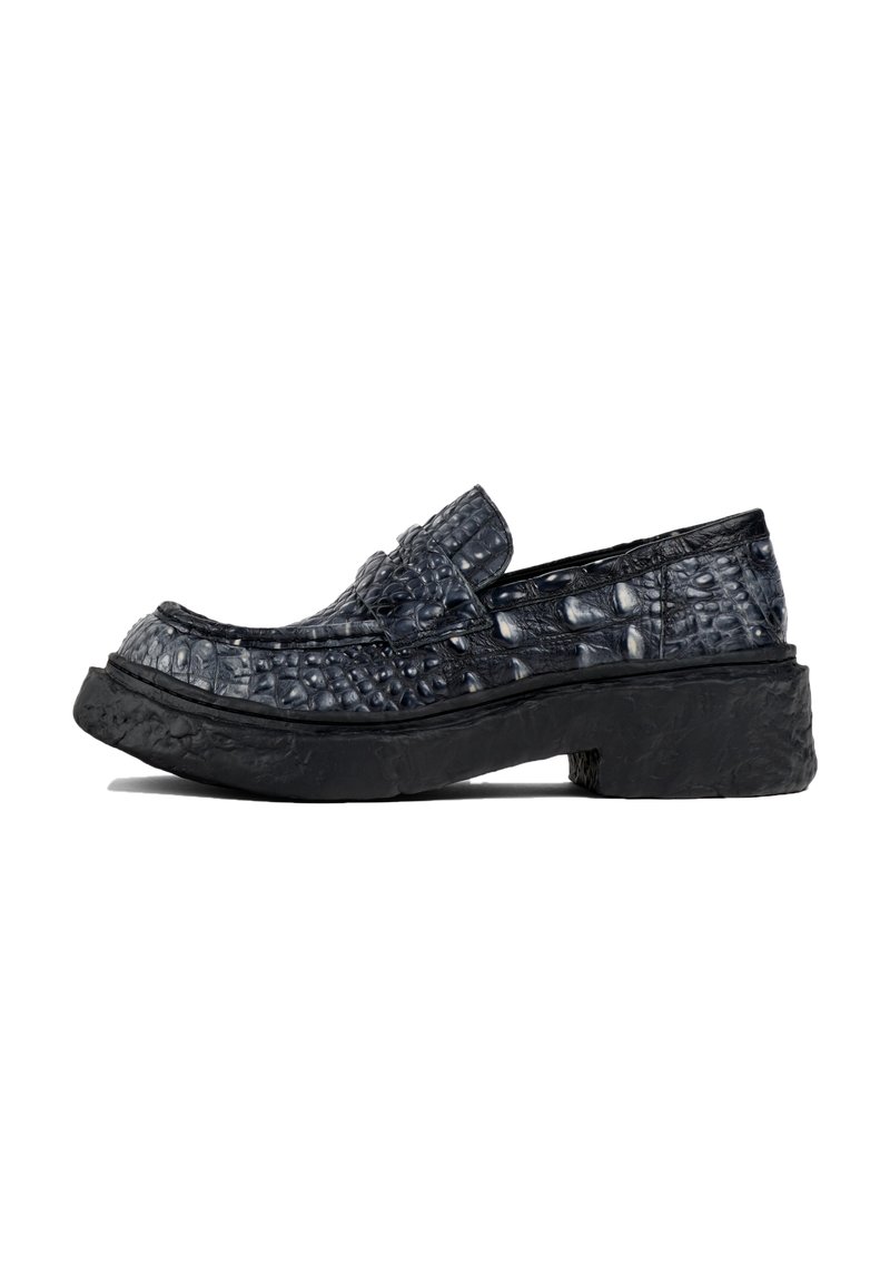 Textured black leather loafers with a platform sole, featuring a glossy crocodile pattern and a slip-on design.