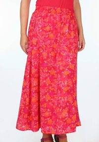 Blumige Maxirock in leuchtendem Pink mit orangefarbenen und pastellfarbenen Blumenmustern, mit einem elastischen Bund und fließendem Stoff.