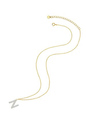 Arany tónusú nyaklánc, ragyogó cirkóniából készült "Z" medállal, finom lánccal és állítható kapoccsal a hosszmódosításhoz.