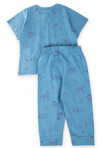 Blue cotton two-piece set featuring short-sleeve top and elastic waist pants. Printed with purple animal and nature patterns. Soft texture.