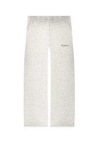 Helle Graue Sweatpants mit entspannter Passform, elastischem Bund, seitlichen Taschen und bedrucktem Text auf der linken Seite. Weicher, texturierter Stoff.