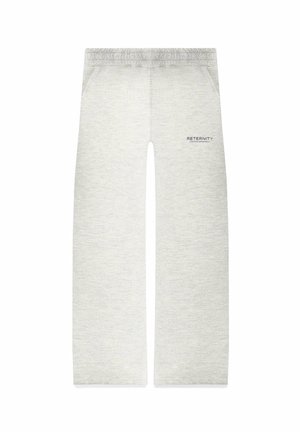 Helle Graue Sweatpants mit entspannter Passform, elastischem Bund, seitlichen Taschen und bedrucktem Text auf der linken Seite. Weicher, texturierter Stoff.