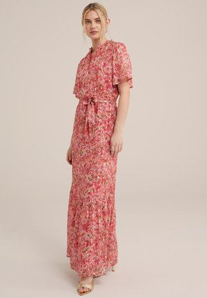 Maxi dress in pink with floral pattern, short flutter sleeves, tie waist, and a layered hem detail. Smooth, lightweight fabric.