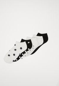 Cinque paia di calzini alla caviglia in bianco e nero. Un paio ha grandi pois, mentre gli altri presentano pois più piccoli e un design a tinta unita. Materiale in cotone morbido.