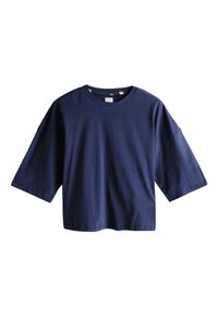T-shirt bleu marine oversize à manches courtes avec col rond, coupe carrée et coutures tombantes aux épaules sur fond blanc.