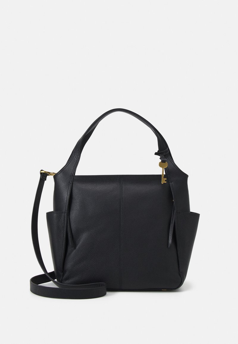 Sac à main en cuir noir avec poignées supérieures, poches latérales et une bandoulière amovible, avec un petit charm en forme de clé dorée sur la poignée.