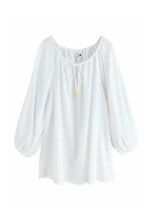 Bluză albă cu mâneci lungi, guler elastic, șnur de legare cu mărgele și mâneci largi umflate.