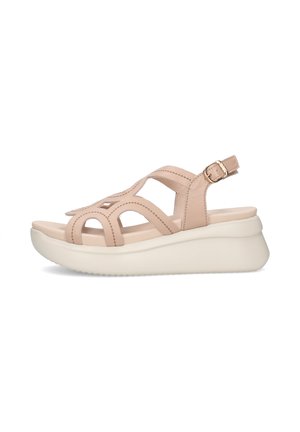 Sandalo con zeppa in pelle beige con cinturino regolabile alla caviglia e suola imbottita, con design traforato sulle cinghie superiori.