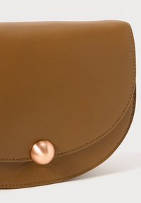 Brown leather pouch with a rounded flap closure, featuring a metallic rose gold-button accent. Smooth texture and clean stitching details.