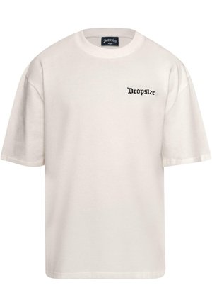 Cream-colored cotton t-shirt with short sleeves, featuring a black "Dropsize" logo on the left chest. Classic crew neck design.