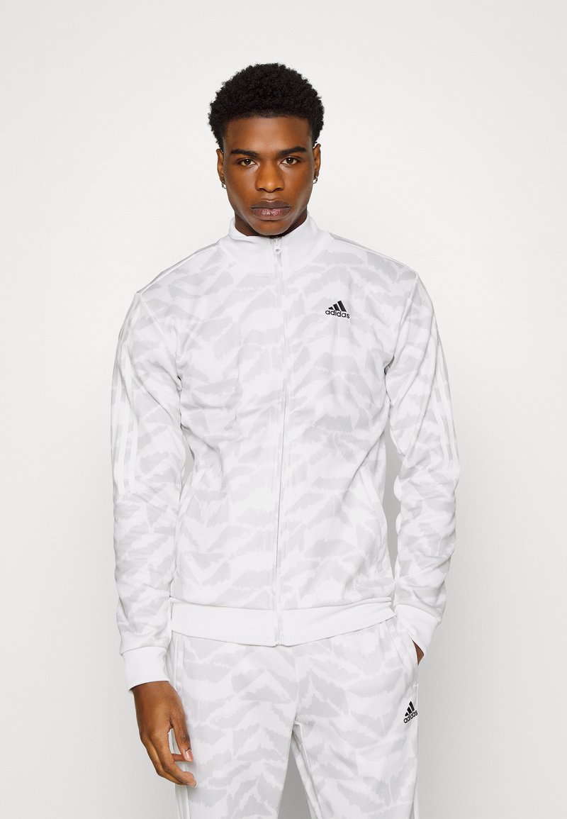 adidas Sportswear M TIRO ADV TP Tracksuit bottoms white Zalando.co.uk