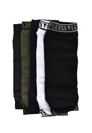 Quatre paires de chaussettes en noir, vert foncé, blanc et bleu foncé, avec des bandes élastiques portant le logo Guess en haut. Matière en mélange de coton.