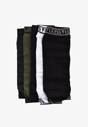 Quatre paires de chaussettes en noir, vert foncé, blanc et bleu foncé, avec des bandes élastiques portant le logo Guess en haut. Matière en mélange de coton.