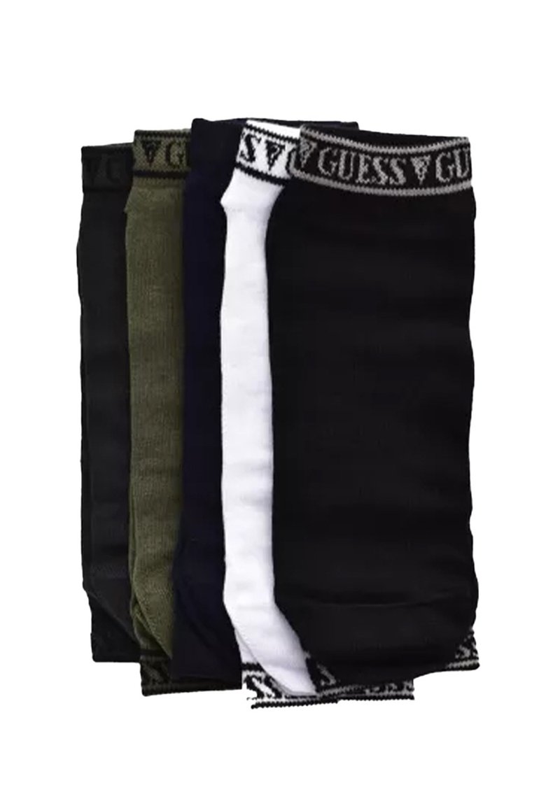 Quatre paires de chaussettes en noir, vert foncé, blanc et bleu foncé, avec des bandes élastiques portant le logo Guess en haut. Matière en mélange de coton.