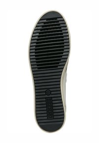 Suela de zapato de goma negra con surcos y relieves texturizados, presenta un logotipo circular en el centro y un borde beige.