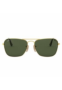 Occhiali da sole in metallo dorato con forma quadrata, lenti verde scuro, naselli beige e aste sottili nere.