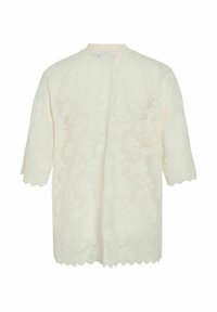 Cárdigan de encaje en color crema con mangas cortas, patrón floral, dobladillo con puntilla y cuello redondo. Tejido ligero y semi-transparente.