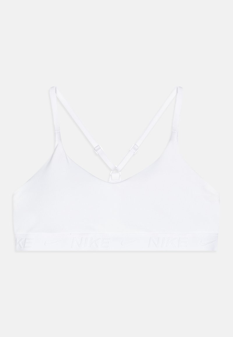 Valge spordibrasi, millel on reguleeritavad rihmad, pehme kangas ja lai elastne bänd, millel on embosseeritud Nike logo. Lihtne, minimalistlik disain.