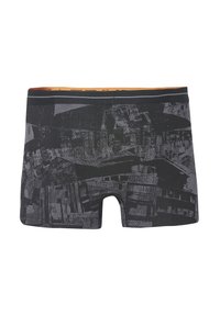 Boxer briefs negros con un patrón gráfico texturizado, cinturilla elástica color beige y un interior en contraste. Están hechos de un material suave y elástico.