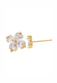 Boucles d'oreilles à clous dorées en forme de trèfle à quatre feuilles, dotées de quatre pierres précieuses transparentes en forme de cœur, finition lisse et fermeture à tige simple.