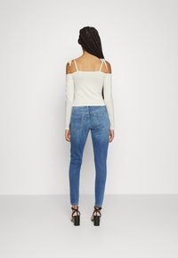 NA-KD BOW DETAIL - Camisola de manga comprida - gardenia