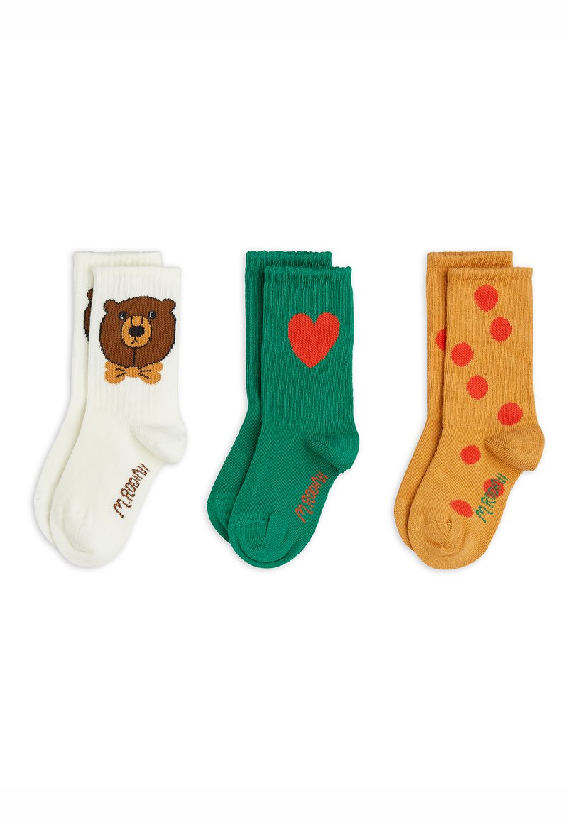 Drei Paare von Kindersocken in Weiß mit Bären, Grün mit rotem Herz und Senfgelb mit roten Punkten.