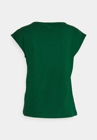 Chemise à manches courtes vert foncé uni avec encolure ronde, vue de dos sur un fond clair uni.