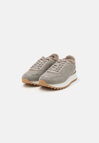 Gray suede sneakers with a plush lining, featuring a white midsole and rubber outsole. Laces and minimal accents in a complementary color.