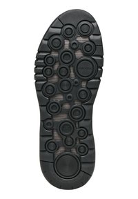 Semelle de chaussure en caoutchouc noir avec des motifs circulaires de tailles variées. Zones texturées pour l'adhérence, portant les mentions "GEOX" et "SYSTÈME DE RESPIRATION NET."