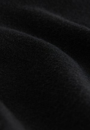 Black wool fabric with a soft, smooth texture; features gentle folds and a consistent, deep color. No visible patterns or hardware.