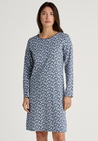 Navy floral dress with long sleeves, round neckline, and a white floral pattern. Made from soft fabric, length falls just above the knees.