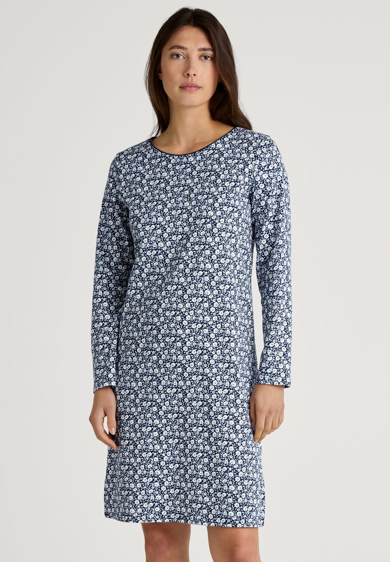 Navy floral dress with long sleeves, round neckline, and a white floral pattern. Made from soft fabric, length falls just above the knees.