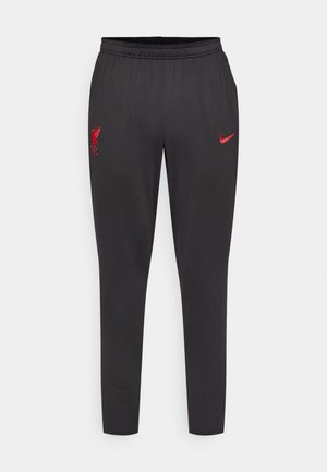 Sorte joggingbukser lavet af glat materiale, med et rødt Liverpool FC-logo og et rødt Nike-swoosh. Elastisk talje for komfort.