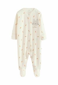 Babyoverall i krämfärg med orange morotsmönster, med en kaninansiktsapplikation, tryckknappar och fotdel.